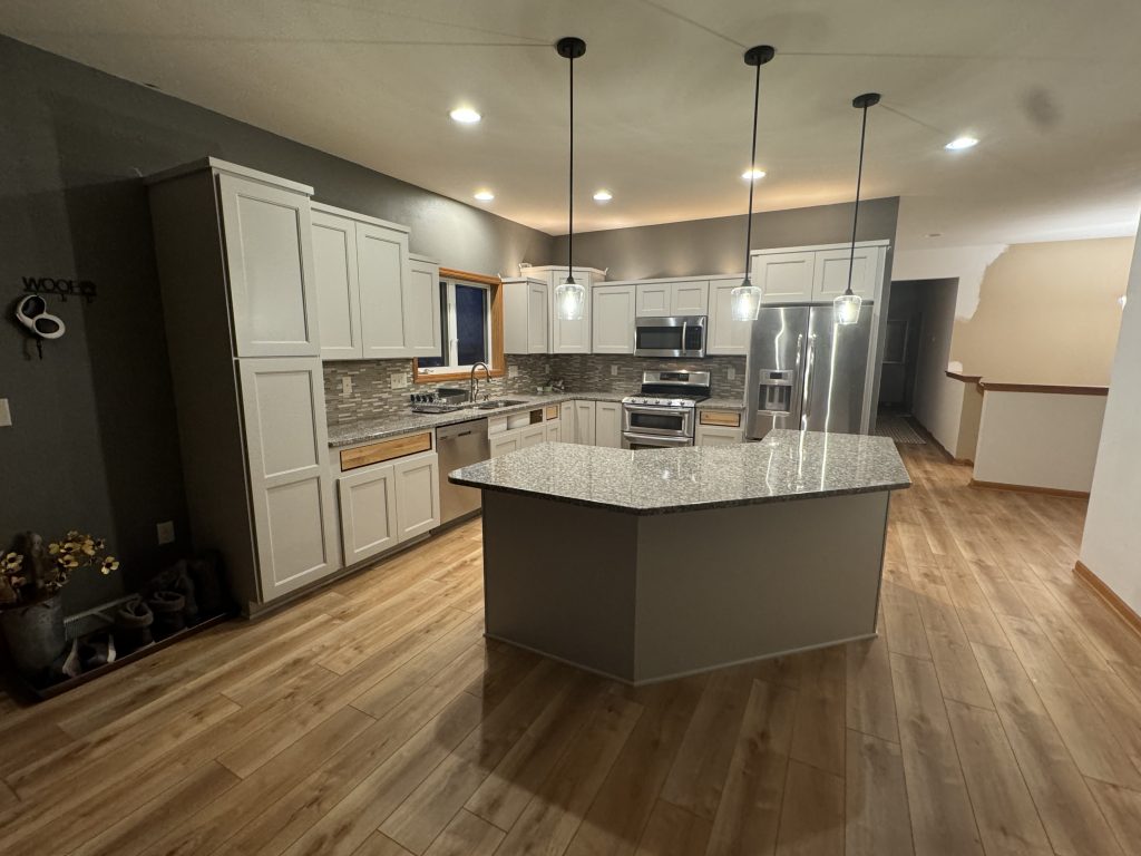 After: Cabinet Refacing. Flooring Shaw Manila Oak